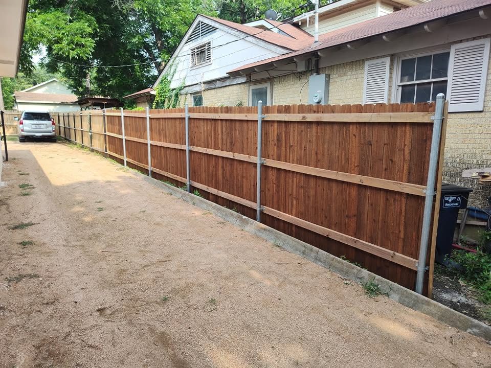 Cedar privacy fence along driveway in Dallas, TX